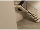 Floating staircase with sleek black metal railings and light steps at 10397 Holt, Chapel Hill, NC 27517