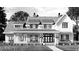 Black and white image of a two story home with a large front porch at 2560 Lassiter Rd, Four Oaks, NC 27524