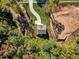 Aerial view of house nestled in a wooded area at 900 Sw Maynard Rd, Cary, NC 27511