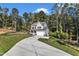 Two-story house with white siding, stone accents, and a two-car garage at 900 Sw Maynard Rd, Cary, NC 27511