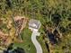 New construction home with a tree-lined lot and curved driveway at 900 Sw Maynard Rd, Cary, NC 27511