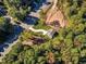 Aerial view showing a house on a lot with surrounding trees and roads at 900 Sw Maynard Rd, Cary, NC 27511