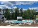 Community pool with cabana and lounge chairs at 124 August Pond Way # 138, Raleigh, NC 27603