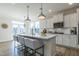 Kitchen island with white cabinets, quartz countertop, and farm sink at 515 Winding Creek Dr, Lillington, NC 27546