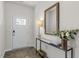 Bright entryway with a console table and mirror at 2204 Fletchers Ridge Dr, Durham, NC 27703