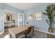 Light and airy home office with a wooden desk at 2204 Fletchers Ridge Dr, Durham, NC 27703