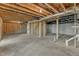 Unfinished basement with exposed framing and concrete floor at 900 Sw Maynard Rd, Cary, NC 27511