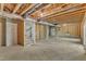 Unfinished basement with exposed framing and concrete floor at 900 Sw Maynard Rd, Cary, NC 27511