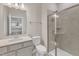 Bathroom with gray vanity, shower, and toilet at 900 Sw Maynard Rd, Cary, NC 27511