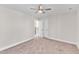 Spacious bedroom with carpet flooring and ceiling fan at 900 Sw Maynard Rd, Cary, NC 27511