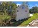 Two story home with gray siding, deck, and wooded lot at 900 Sw Maynard Rd, Cary, NC 27511