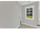 Laundry room with hexagon tile floor and window at 900 Sw Maynard Rd, Cary, NC 27511