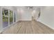 Spacious living room with hardwood floors and sliding glass doors to deck at 900 Sw Maynard Rd, Cary, NC 27511