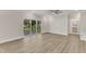 Spacious living room with hardwood floors and sliding glass doors to deck at 900 Sw Maynard Rd, Cary, NC 27511