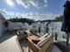 Private rooftop deck with outdoor furniture and city views at 11549 Helmond Way # 102, Raleigh, NC 27617