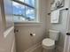 Clean and functional half bathroom with a toilet and sink at 11549 Helmond Way # 102, Raleigh, NC 27617