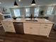 Kitchen island with seating and stainless steel dishwasher at 11549 Helmond Way # 102, Raleigh, NC 27617