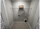 Laundry room with shelving and hookups at 11549 Helmond Way # 102, Raleigh, NC 27617