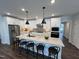Modern kitchen with island and stainless steel appliances at 11549 Helmond Way # 102, Raleigh, NC 27617