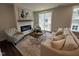Living room with fireplace and comfortable seating at 11549 Helmond Way # 102, Raleigh, NC 27617