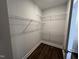 Large walk-in closet featuring wire shelving for convenient storage at 11549 Helmond Way # 102, Raleigh, NC 27617
