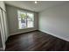 Bright bedroom with large window and hardwood floors at 11549 Helmond Way # 102, Raleigh, NC 27617
