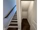 Modern stairs with dark wood accents at 11549 Helmond Way # 102, Raleigh, NC 27617