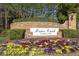 Brier Creek Country Club entrance with landscaped flowerbeds at 11549 Helmond Way # 102, Raleigh, NC 27617