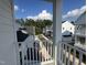 Community view from balcony showcasing new construction homes at 11549 Helmond Way # 102, Raleigh, NC 27617