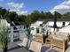 Spacious rooftop deck featuring comfortable seating and city views at 11549 Helmond Way # 102, Raleigh, NC 27617