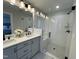 Modern bathroom with double vanity, large shower, and elegant fixtures at 11549 Helmond Way # 102, Raleigh, NC 27617