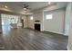 Spacious living room with fireplace and hardwood floors at 324 Village Walk Dr, Clayton, NC 27527