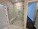 Bathroom with large walk-in shower and marble tile at 324 Village Walk Dr, Clayton, NC 27527