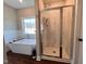 Bathroom boasts a soaking tub and a walk-in shower with marble tile at 3701 Greystone Dr, Rocky Mount, NC 27804