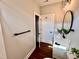 Clean bathroom with white vanity, linen closet and wood floor at 3701 Greystone Dr, Rocky Mount, NC 27804