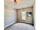 Bright bedroom with carpeted floor, large window, and neutral wall paint at 3701 Greystone Dr, Rocky Mount, NC 27804