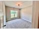 Bright bedroom with neutral carpeting and large window at 3701 Greystone Dr, Rocky Mount, NC 27804