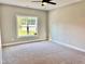 Bright bedroom with carpet and large window at 3701 Greystone Dr, Rocky Mount, NC 27804