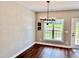 Bright dining area with hardwood floors and large window at 3701 Greystone Dr, Rocky Mount, NC 27804