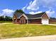 Brick home with a two-car garage and nicely landscaped lawn at 3701 Greystone Dr, Rocky Mount, NC 27804
