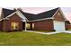 Brick home with a two-car garage and landscaped lawn at 3701 Greystone Dr, Rocky Mount, NC 27804