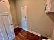 Laundry room with white cabinets and wood flooring at 3701 Greystone Dr, Rocky Mount, NC 27804