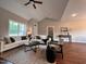 Spacious living room with vaulted ceiling, hardwood floors, and comfortable seating at 3701 Greystone Dr, Rocky Mount, NC 27804