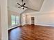 Open living area with hardwood floors and a high ceiling at 3701 Greystone Dr, Rocky Mount, NC 27804