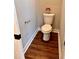 Clean and simple powder room with wood flooring at 3701 Greystone Dr, Rocky Mount, NC 27804