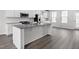 Modern kitchen with granite countertops and island at 1222 Helms St, Durham, NC 27713