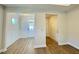 Bright entryway with hardwood floors and wainscoting at 347 Village Walk Dr, Clayton, NC 27527