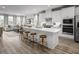 Open concept kitchen with island and stainless steel appliances. Living room view at 1226 Helms St, Durham, NC 27713