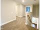 Upstairs hallway with carpeted floors and access to bedrooms at 217 Rolling Pasture Way, Sanford, NC 27332