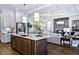 Modern kitchen with large island and stainless steel appliances at 2865 Silk Hope Gum Springs Rd, Pittsboro, NC 27312